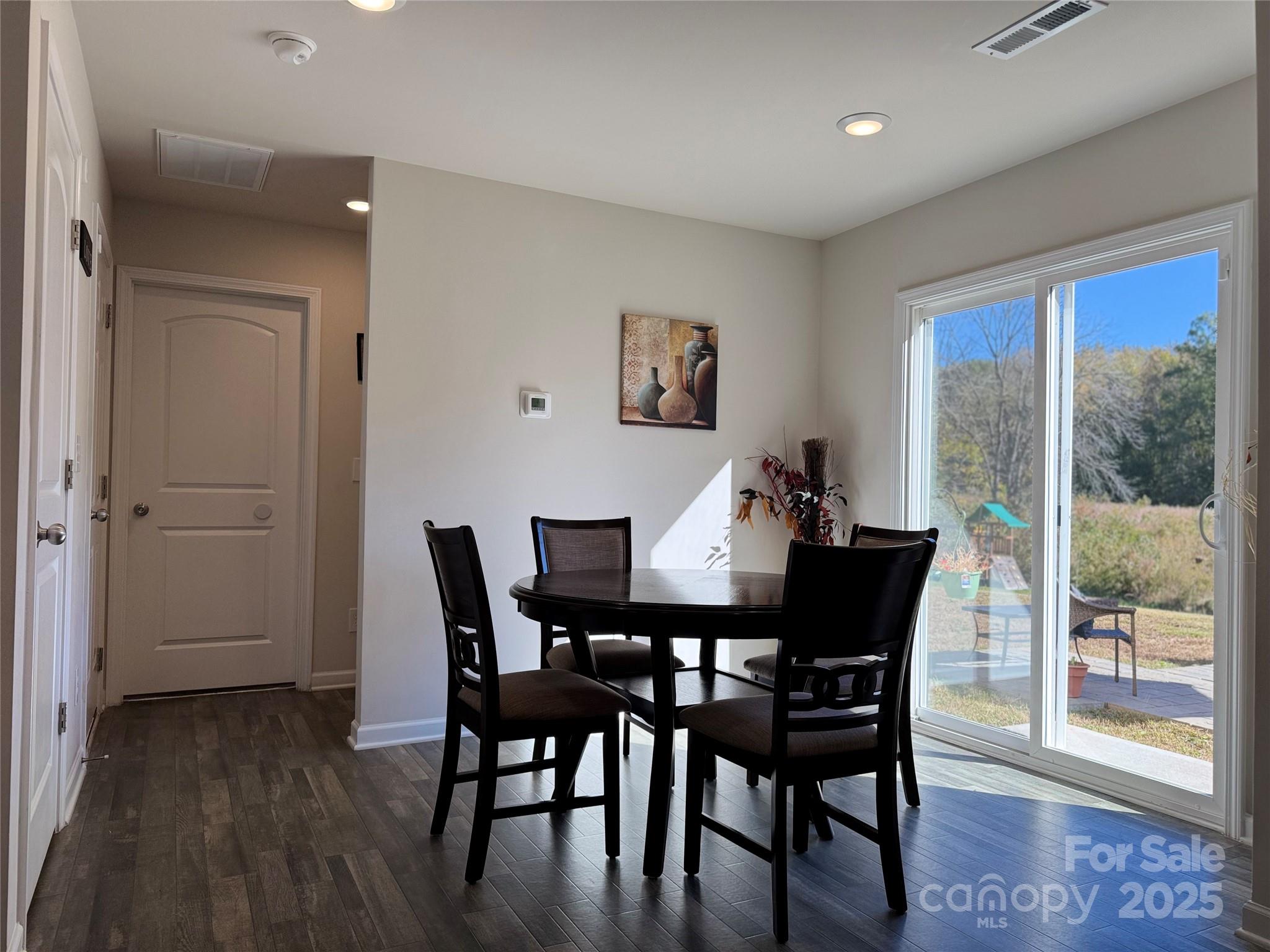 327 J C Dellinger Road Cherryville, NC 28021 - Photo 16 of 30 a view of a dining room with furniture window and wooden floor