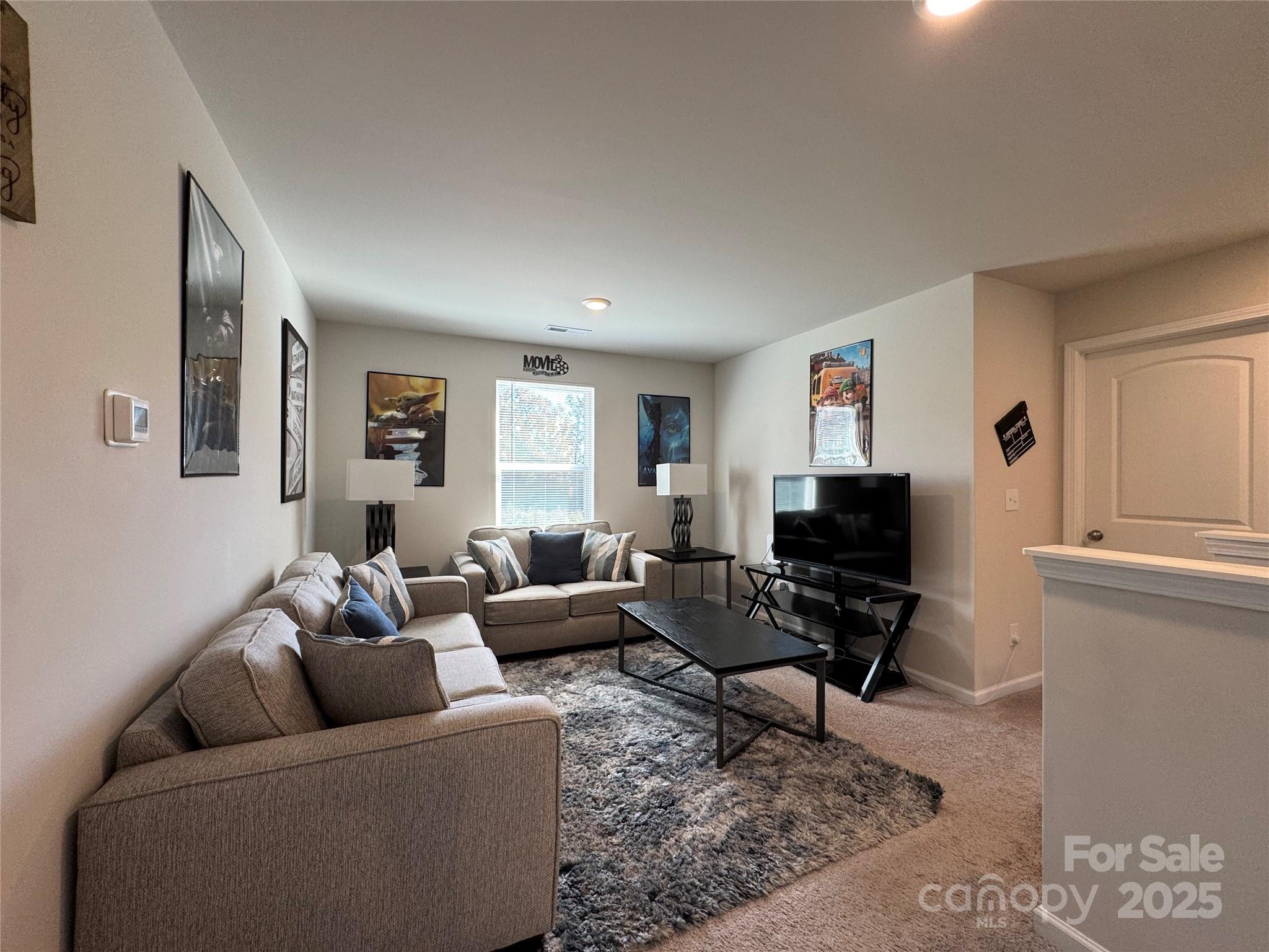 327 J C Dellinger Road Cherryville, NC 28021 - Photo 18 of 30 a living room with furniture and a flat screen tv