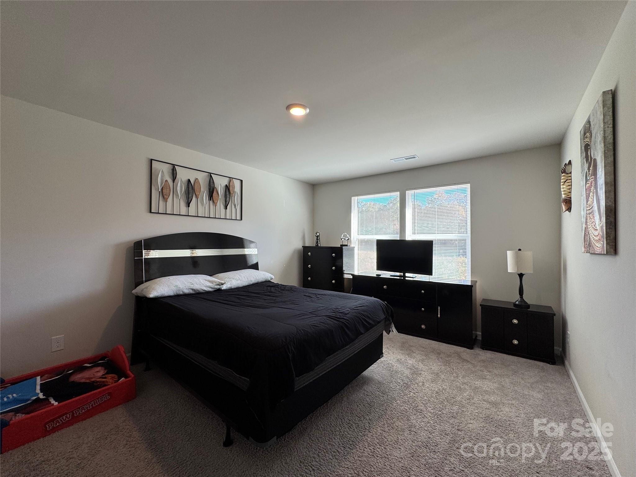 327 J C Dellinger Road Cherryville, NC 28021 - Photo 20 of 30 a spacious bedroom with a bed and dresser