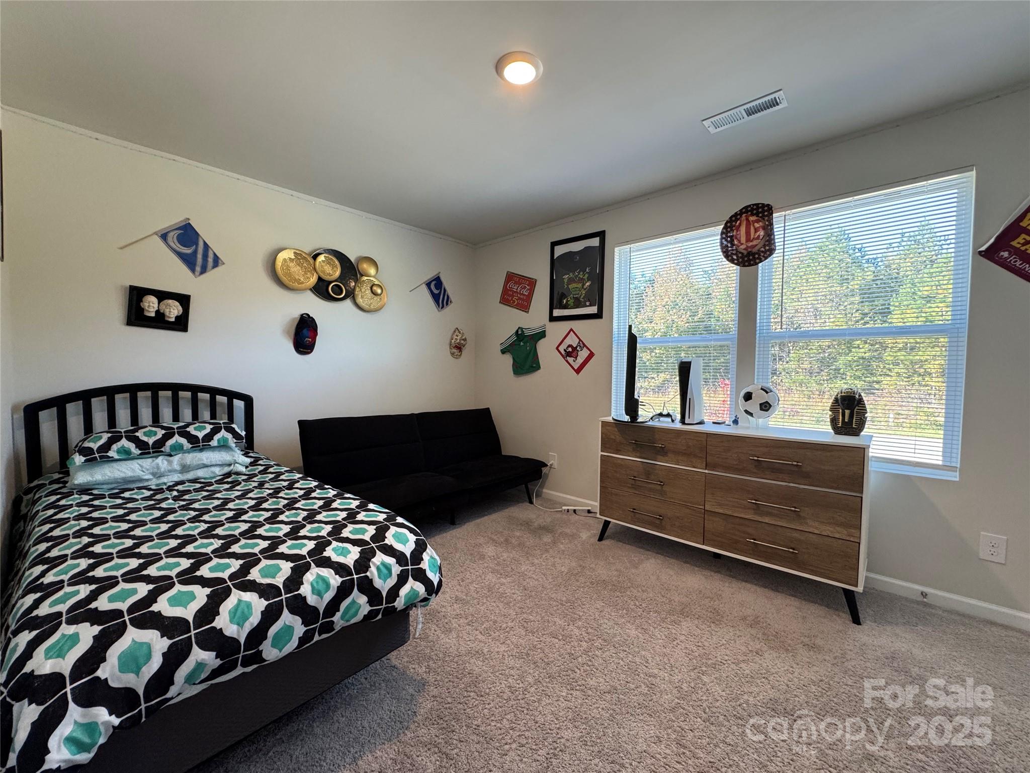 327 J C Dellinger Road Cherryville, NC 28021 - Photo 23 of 30 a bedroom with a bed and a large window