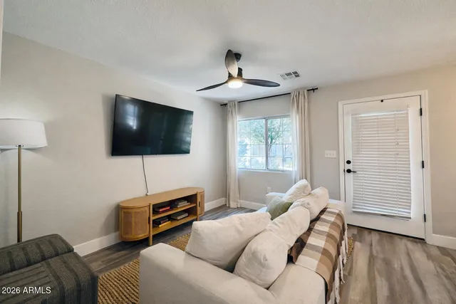 a living room with furniture and a flat screen tv