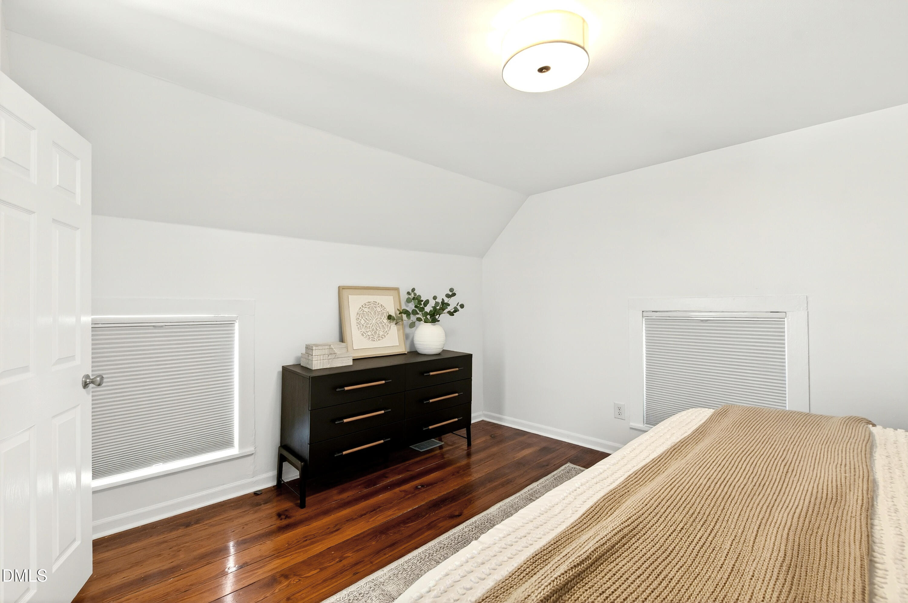 913 Washington Street Durham, NC 27701 - Photo 22 of 37 a bedroom with a bed and a dresser