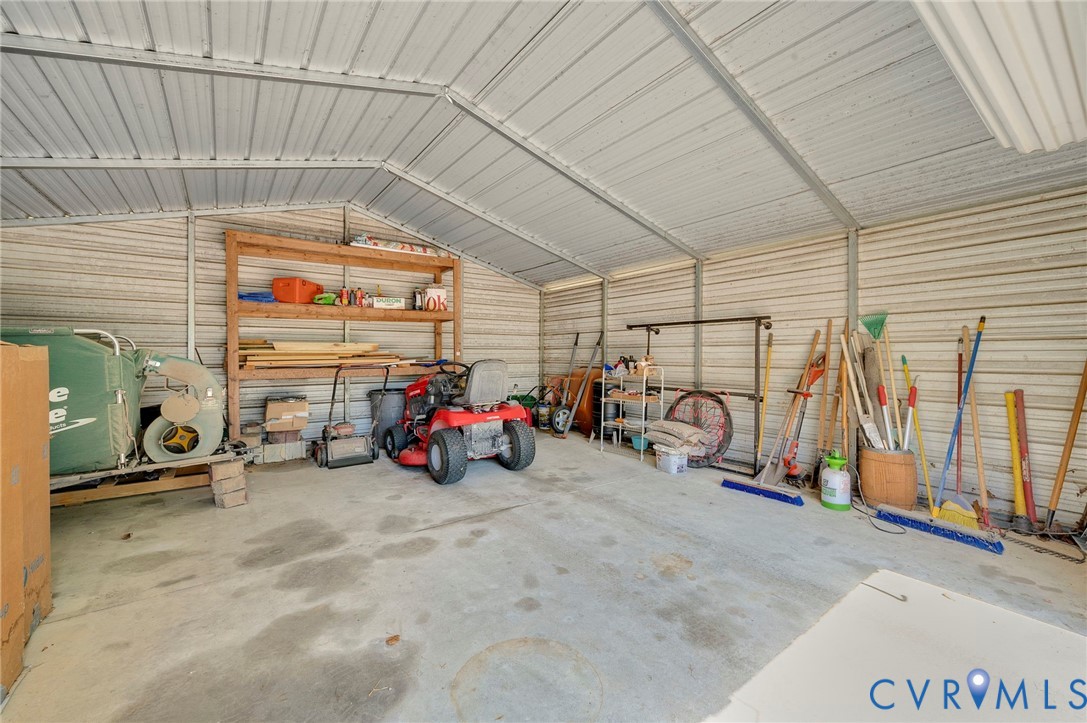 17170 Templeton Road Disputanta, VA 23842 - Photo 25 of 27 a view of a garage with parked cars