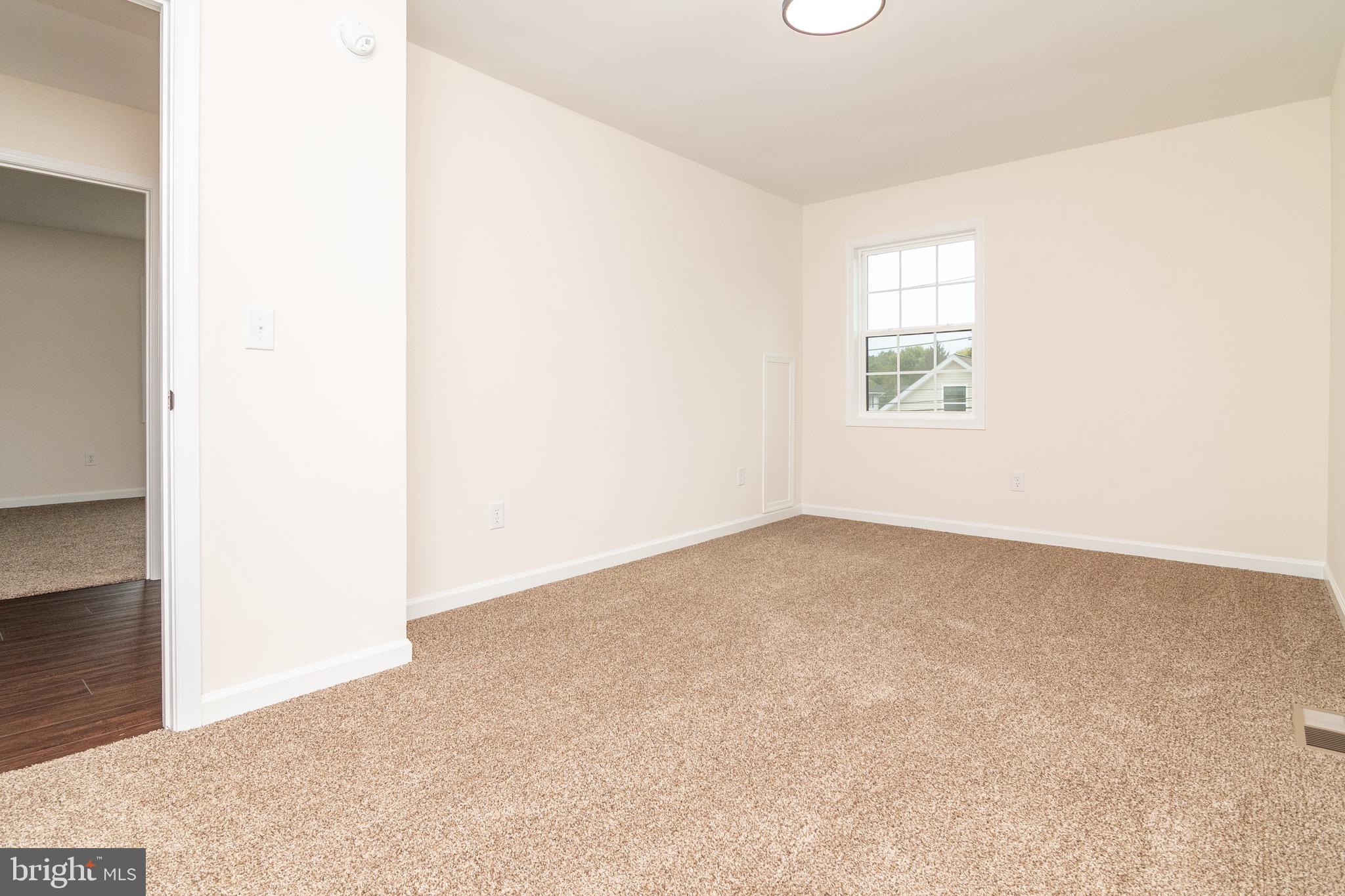 105 East Adams Street Georgetown, DE 19947 - Photo 21 of 49 an empty room with windows