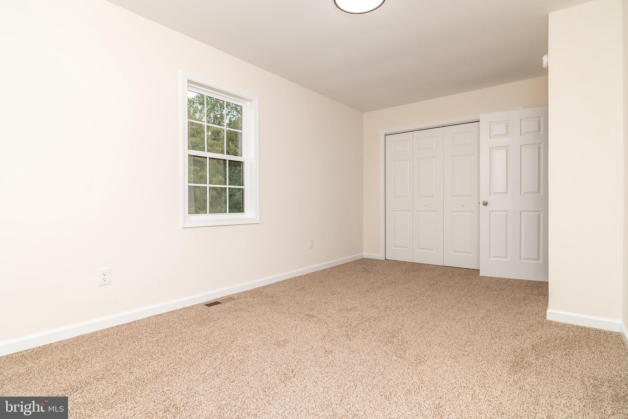 105 East Adams Street Georgetown, DE 19947 - Photo 22 of 49 an empty room with windows