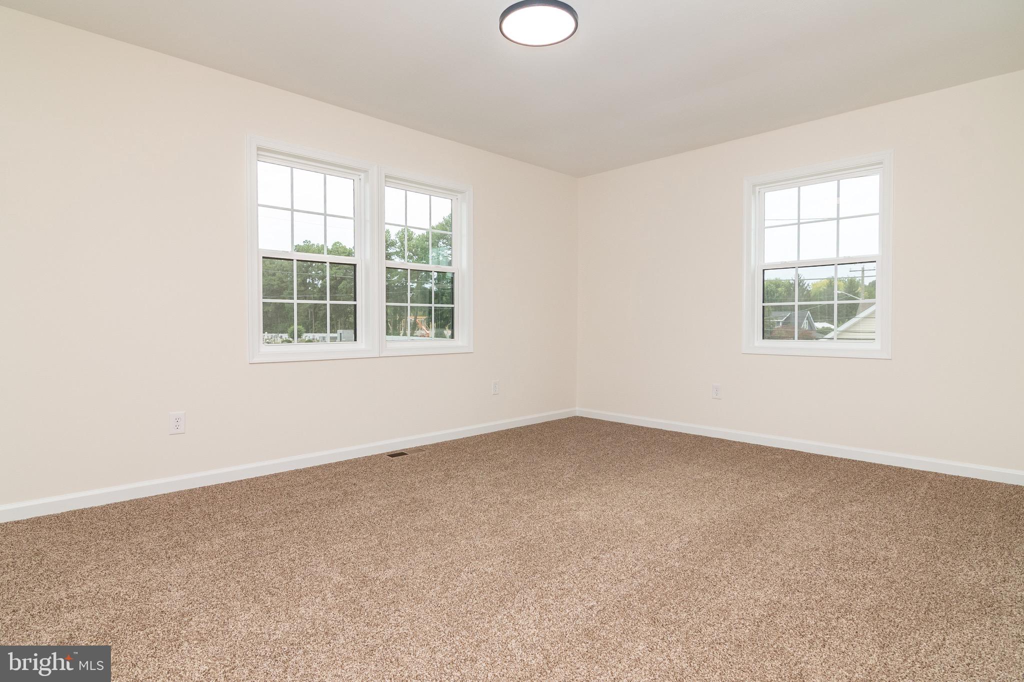 105 East Adams Street Georgetown, DE 19947 - Photo 24 of 49 an empty room with a window