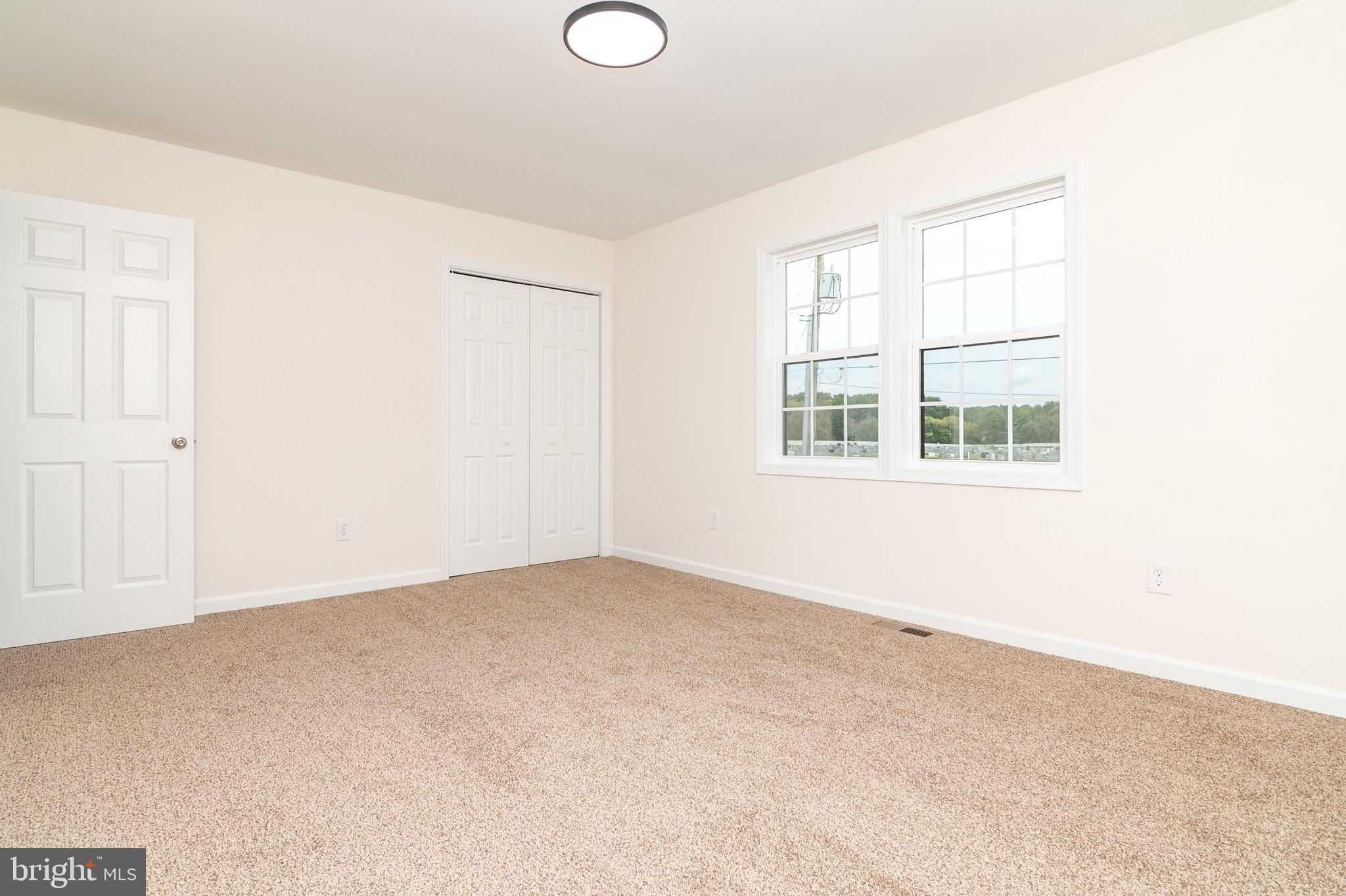 105 East Adams Street Georgetown, DE 19947 - Photo 26 of 49 an empty room with windows