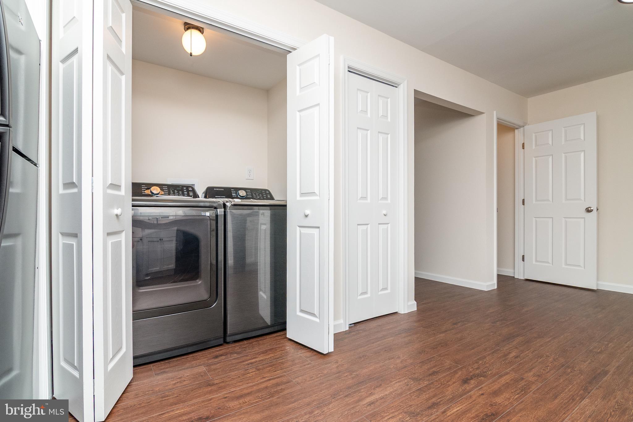 105 East Adams Street Georgetown, DE 19947 - Photo 35 of 49 a view of a kitchen with a sink a refrigerator and cabinets