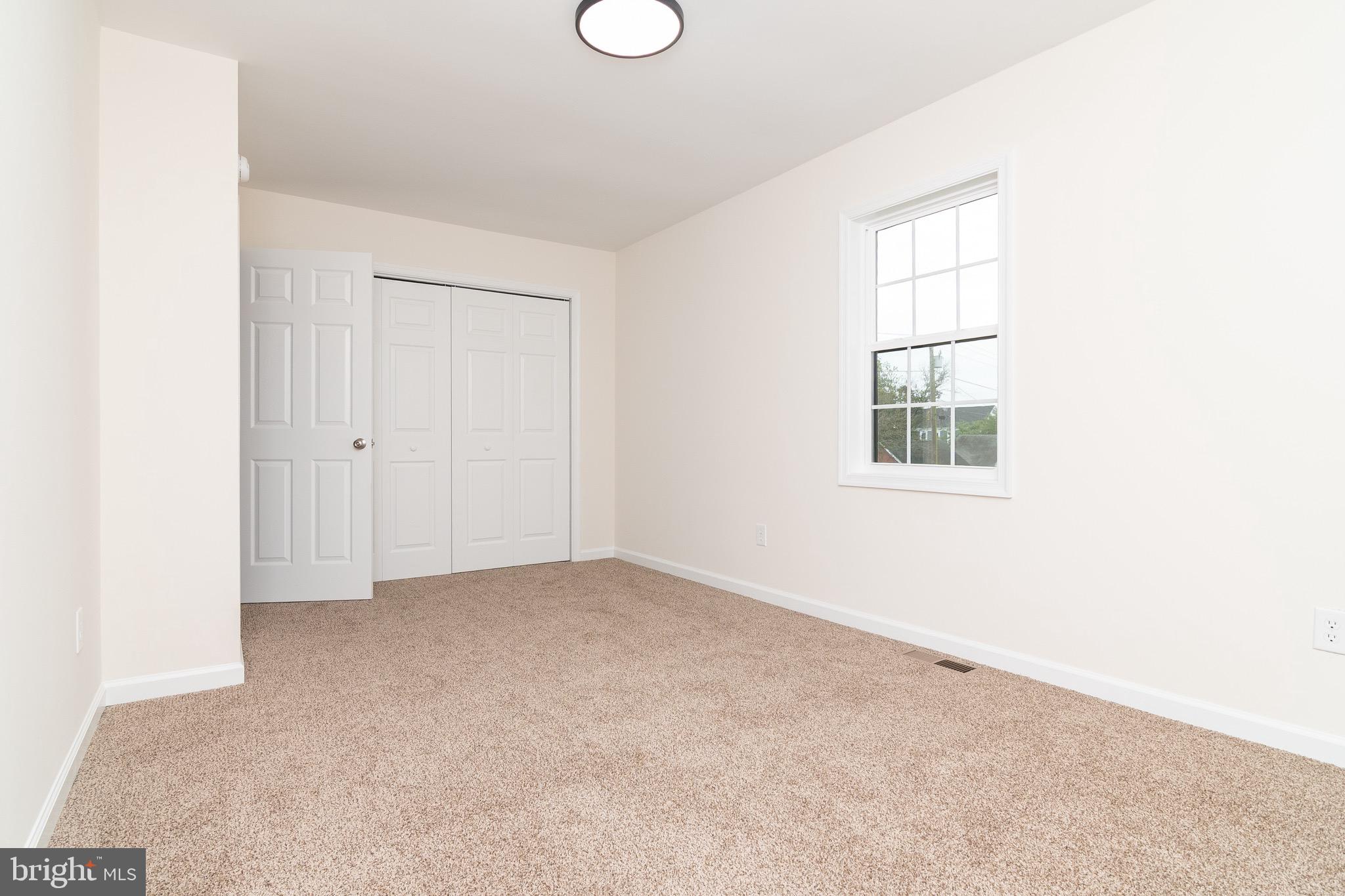 105 East Adams Street Georgetown, DE 19947 - Photo 44 of 49 an empty room with windows