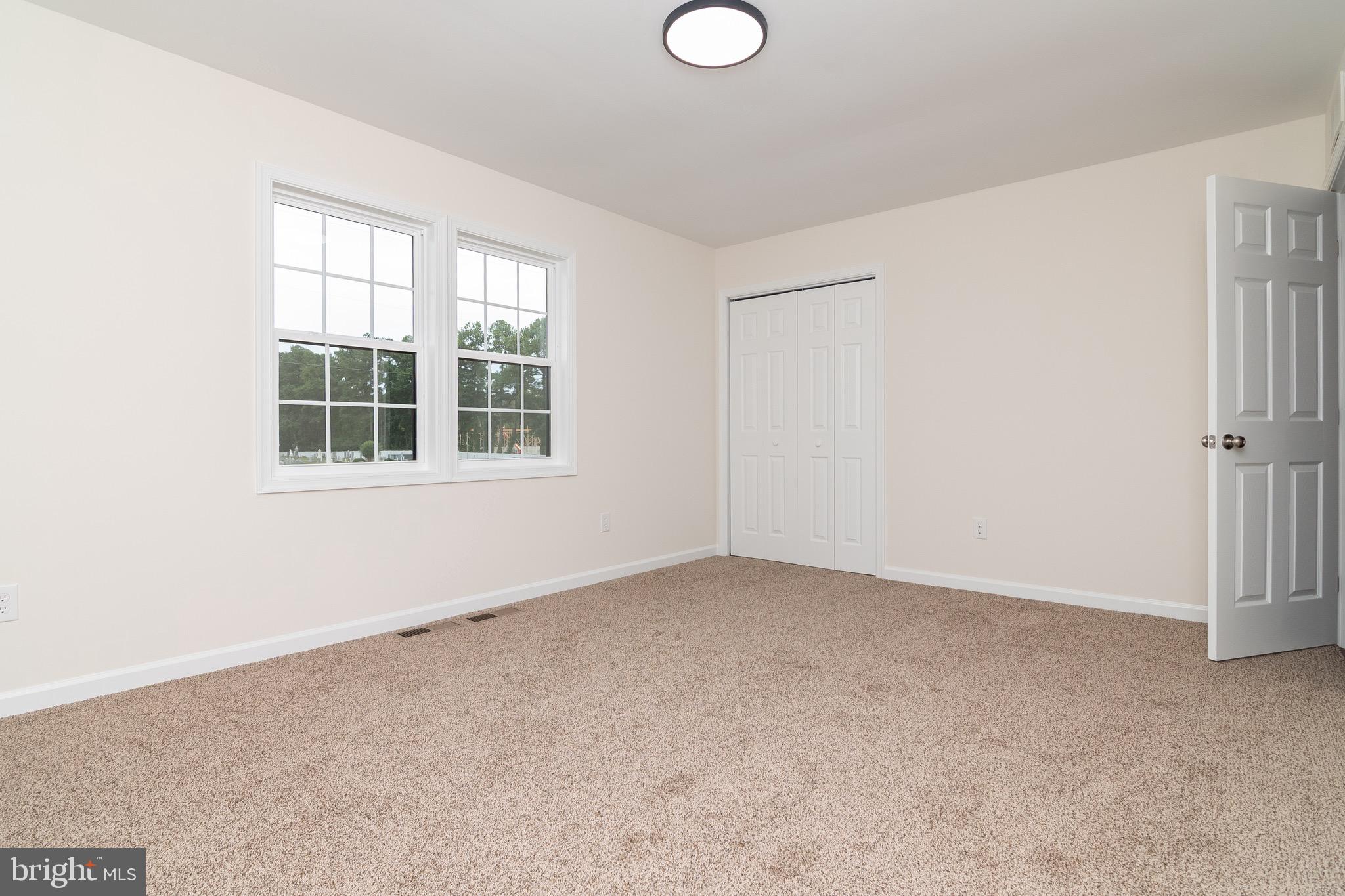 105 East Adams Street Georgetown, DE 19947 - Photo 46 of 49 an empty room with windows