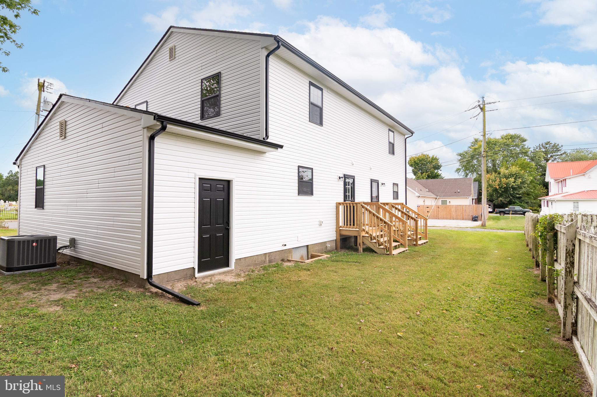 105 East Adams Street Georgetown, DE 19947 - Photo 5 of 49 a view of a house with backyard