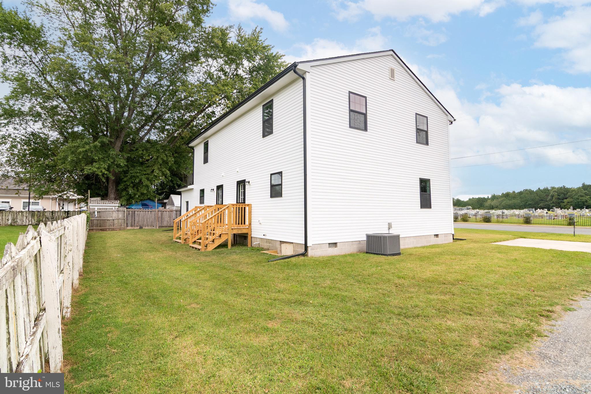 105 East Adams Street Georgetown, DE 19947 - Photo 8 of 49 a view of a house with backyard