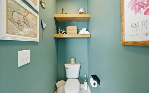 a bathroom with a toilet and a sink