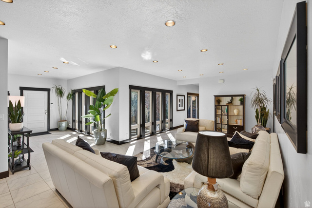 145 Carnesecca Court Mapleton, UT 84664 - Photo 9 of 109 Living room featuring recessed lighting and a textured ceiling