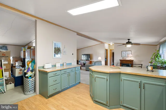 a kitchen with a sink cabinets and window