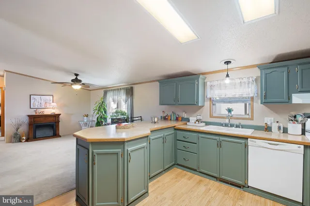 a kitchen with stainless steel appliances granite countertop a refrigerator and a stove