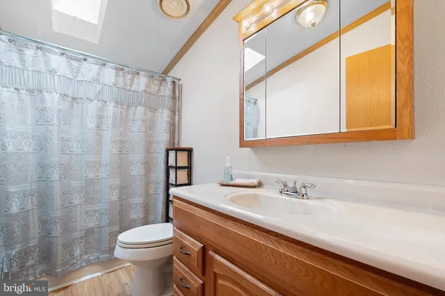 a bedroom with a bed gym equipment and a window