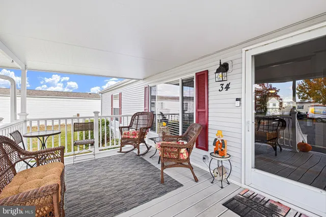 a reading room with furniture and wooden floor
