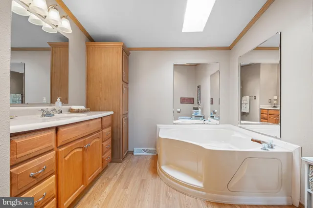 a spacious bathroom with sink double vanity