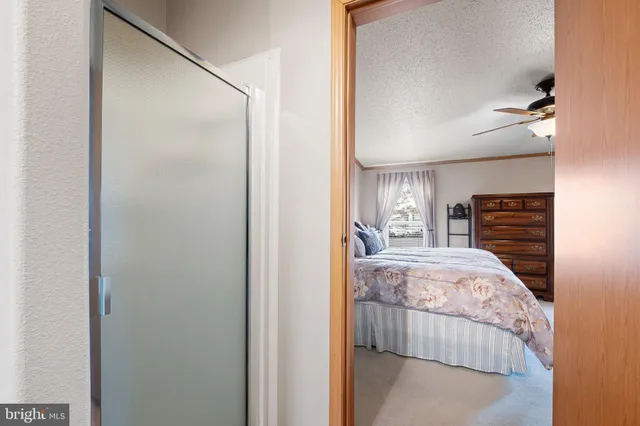 a bedroom with a bed and a fireplace