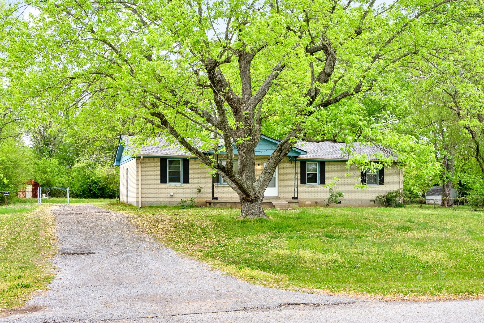 511 Ruby Drive Clarksville, TN 37040 - Photo 2 of 25 a white house that has a tree in front of it