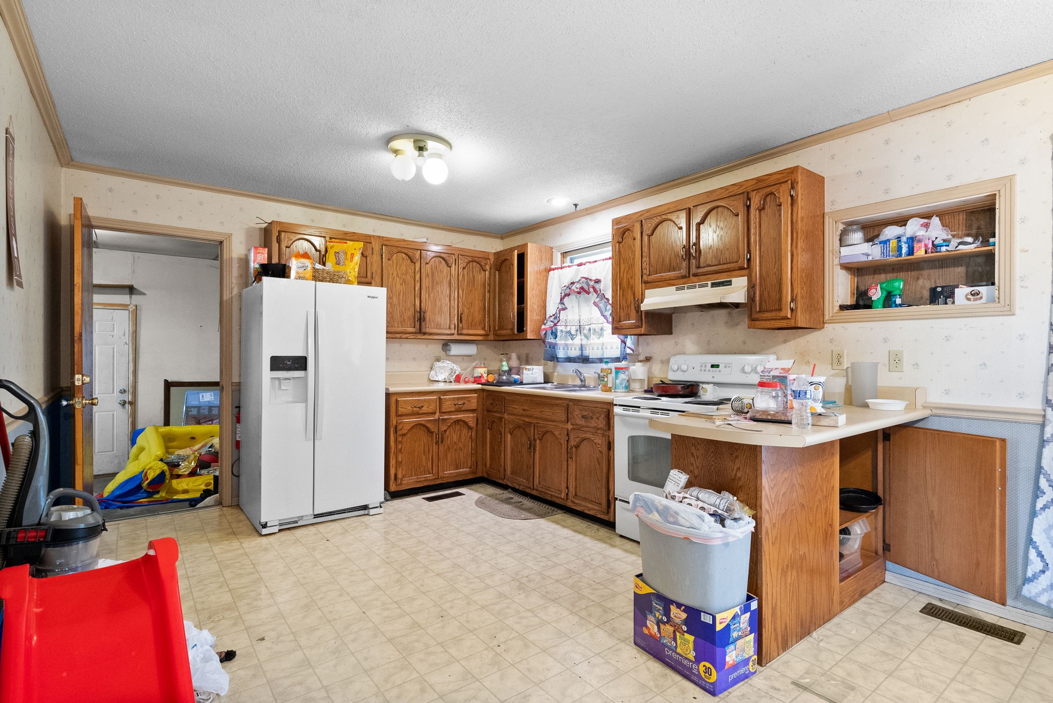 511 Ruby Drive Clarksville, TN 37040 - Photo 9 of 25 a kitchen with refrigerator and cabinets