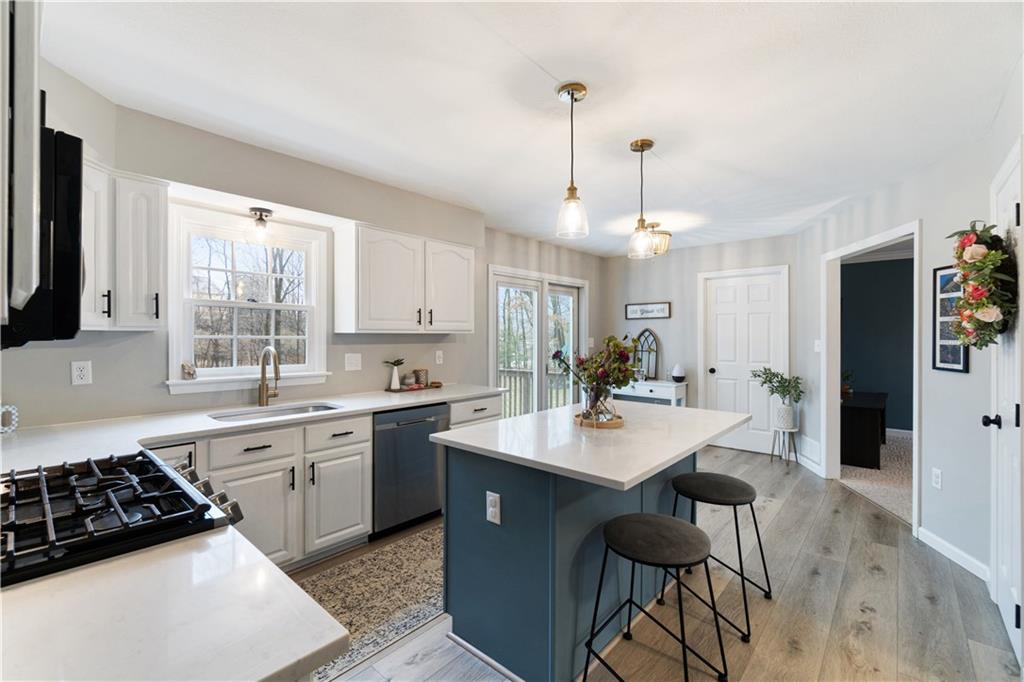 528 Pine Bluff Drive Mars, PA 16046 - Photo 12 of 25 a kitchen with a sink a stove a refrigerator and white cabinets