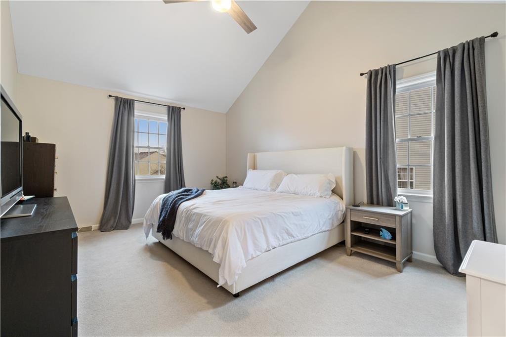 528 Pine Bluff Drive Mars, PA 16046 - Photo 14 of 25 a bedroom with a bed tv and a large window