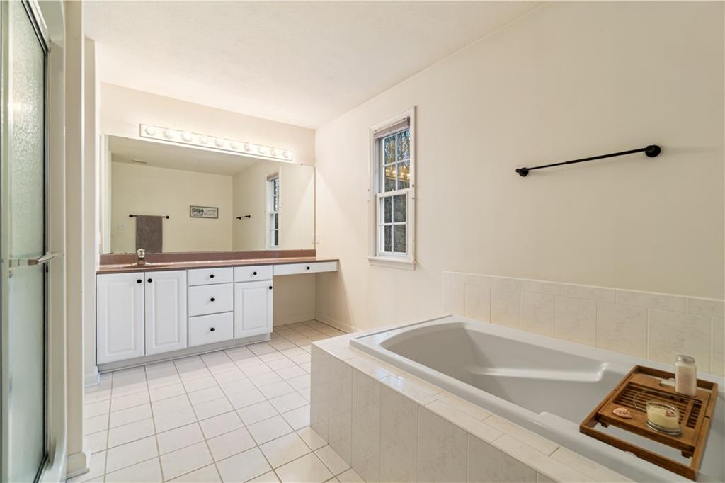 528 Pine Bluff Drive Mars, PA 16046 - Photo 16 of 25 a bathroom with a tub sink and mirror