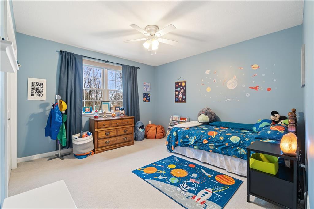 528 Pine Bluff Drive Mars, PA 16046 - Photo 20 of 25 a living room with furniture and a baby crib