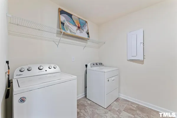 a view of storage and utility room with washer and dryer