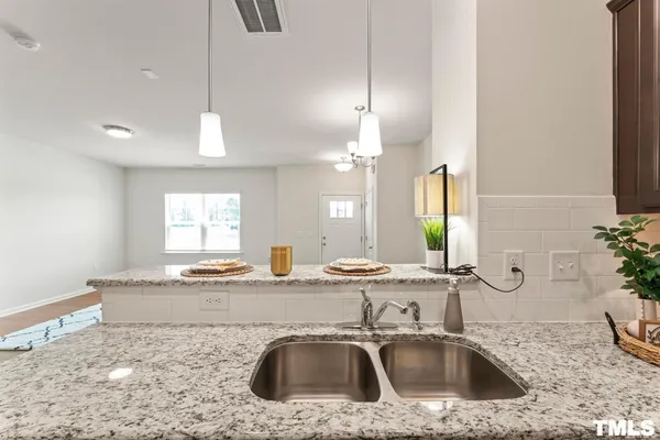 a bathroom with a sink a vanity and a mirror