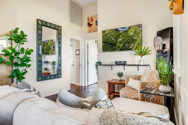 a view of a dining room with furniture and a window