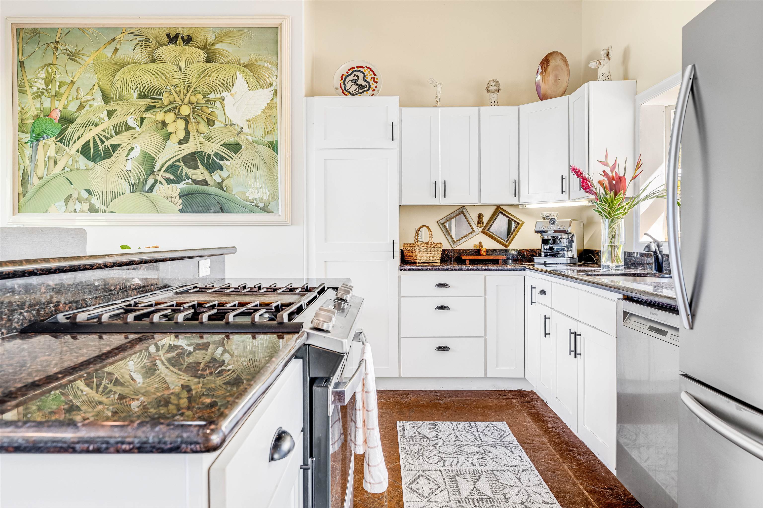 1004 North Honokala Road, Unit B Haiku, HI 96708 - Photo 20 of 49 a kitchen with stainless steel appliances granite countertop a stove a sink and a white refrigerator