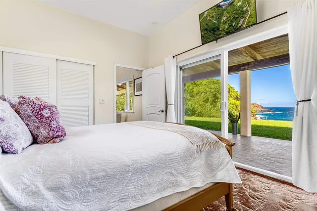 a bed room with a bed and a window