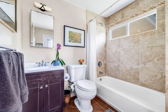 a view of a hallway with washer and dryer