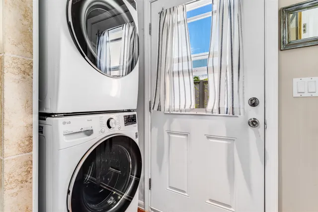 a view of front door and potted plants