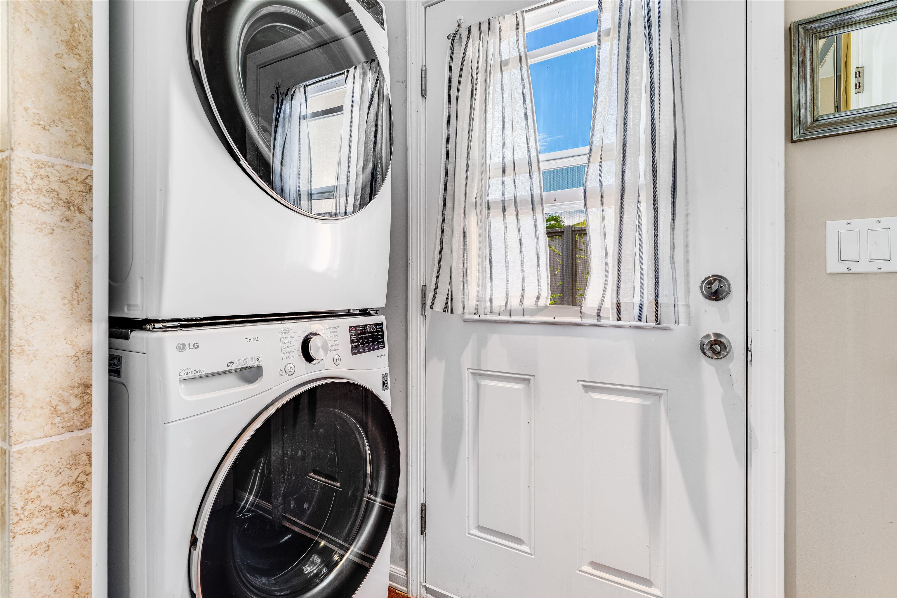 1004 North Honokala Road, Unit B Haiku, HI 96708 - Photo 32 of 48 a view of a hallway with washer and dryer