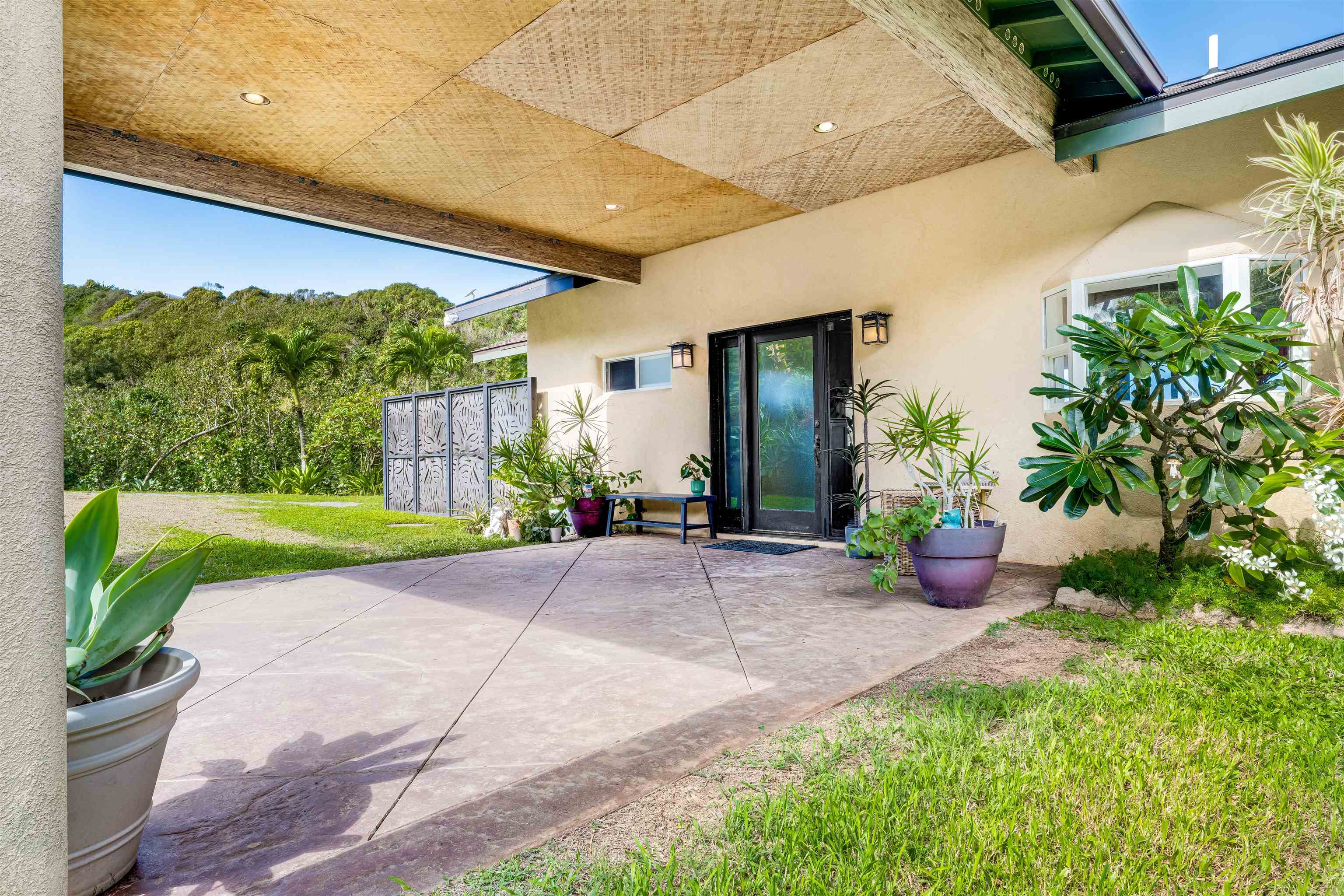 1004 North Honokala Road, Unit B Haiku, HI 96708 - Photo 38 of 49 a view of a patio with plants and garden