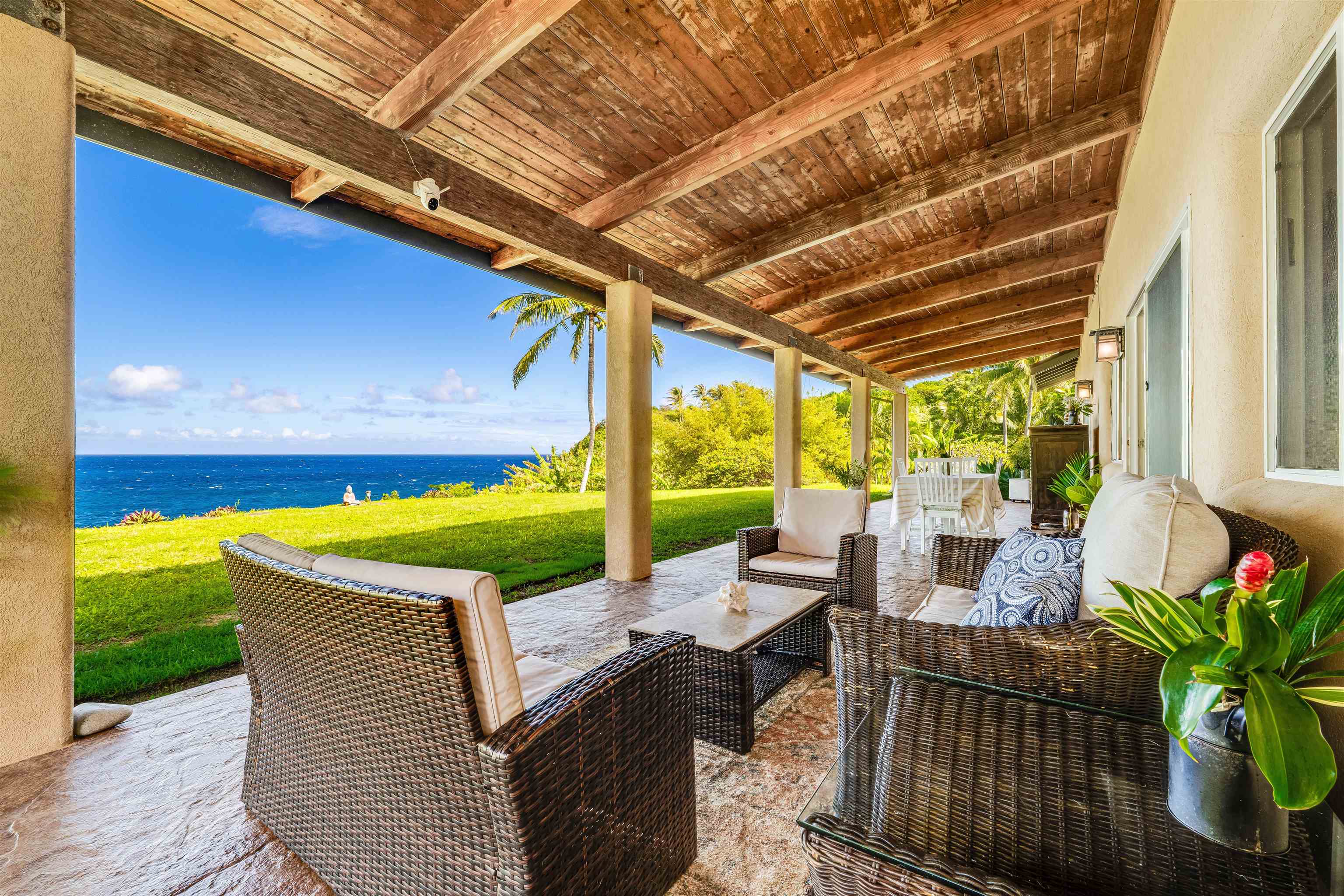 1004 North Honokala Road, Unit B Haiku, HI 96708 - Photo 4 of 49 a view of a patio with a table and chairs