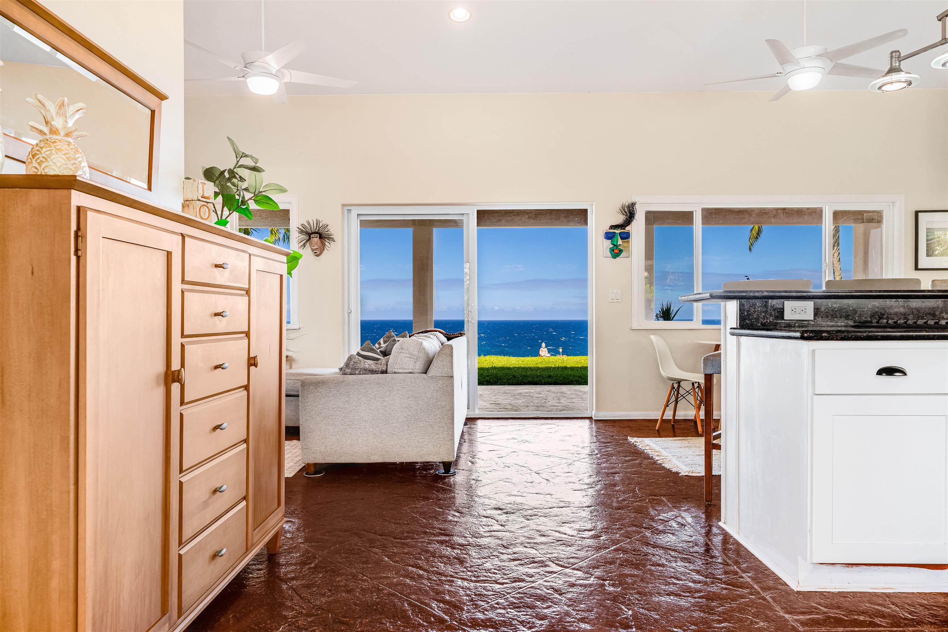 1004 North Honokala Road, Unit B Haiku, HI 96708 - Photo 10 of 49 a living room with kitchen island furniture and a kitchen view