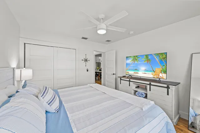 a bedroom with a bed and a desk