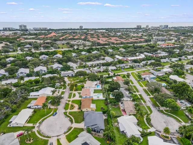 an aerial view of residential houses with outdoor space