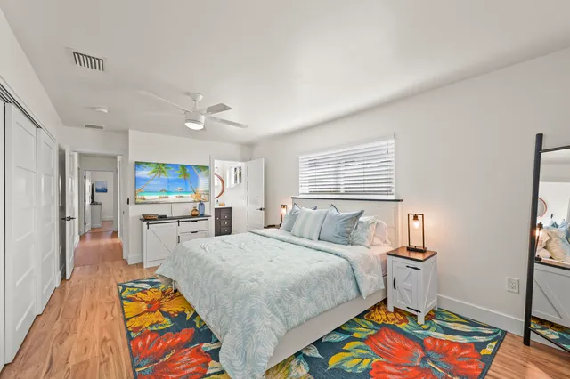 a bedroom with a bed and a table