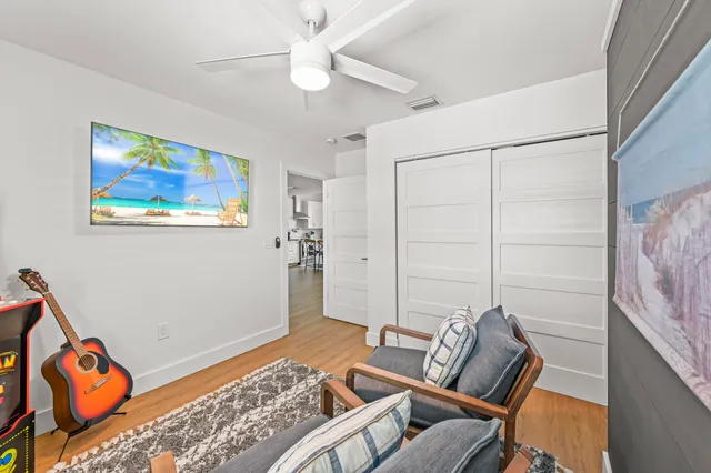 a bedroom with furniture and a rug