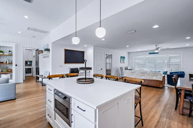 a view of kitchen island dining room cabinets and wooden floor