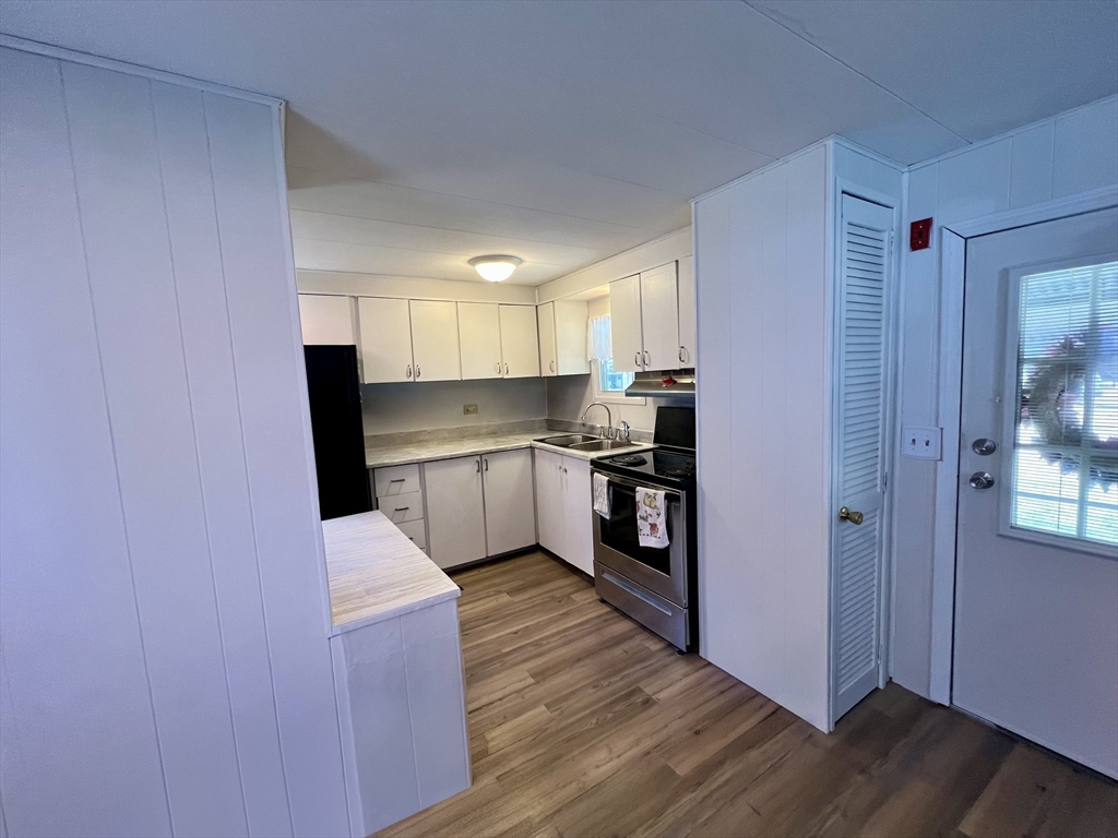 23 Riverview Circle Brimfield, MA 01010 - Photo 5 of 14 a kitchen with stainless steel appliances a refrigerator and a stove top oven