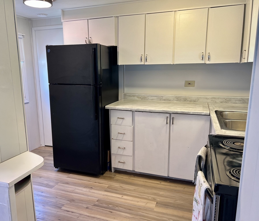 23 Riverview Circle Brimfield, MA 01010 - Photo 6 of 14 a kitchen with a refrigerator and a sink