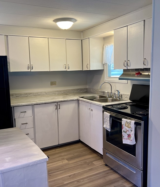 23 Riverview Circle Brimfield, MA 01010 - Photo 7 of 14 a kitchen with a sink stove and cabinets