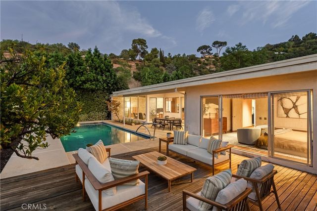 a outdoor living space with furniture and garden view
